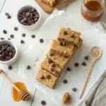 Stack of homemade peanut butter protein bars with chocolate chips