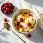 Protein Greek yogurt ice cream with mango and raspberries
